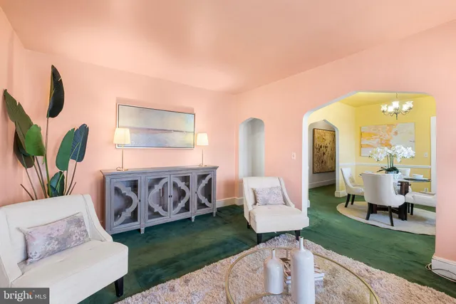 a living room with furniture and a garden