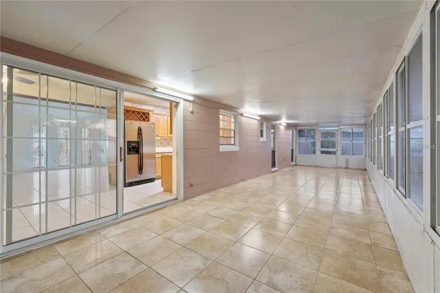 a view of an empty room and a window