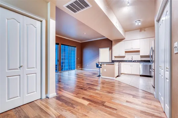 a view of a kitchen from the hallway