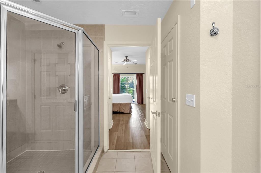 7662 Whisper Way, Unit 103 Reunion, FL 34747 - Photo 14 of 39 a view of a bathroom from a hallway