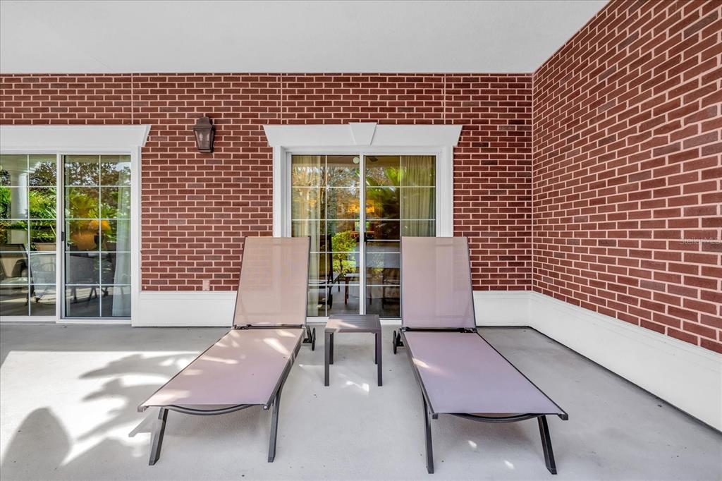 7662 Whisper Way, Unit 103 Reunion, FL 34747 - Photo 23 of 39 a balcony with furniture and window