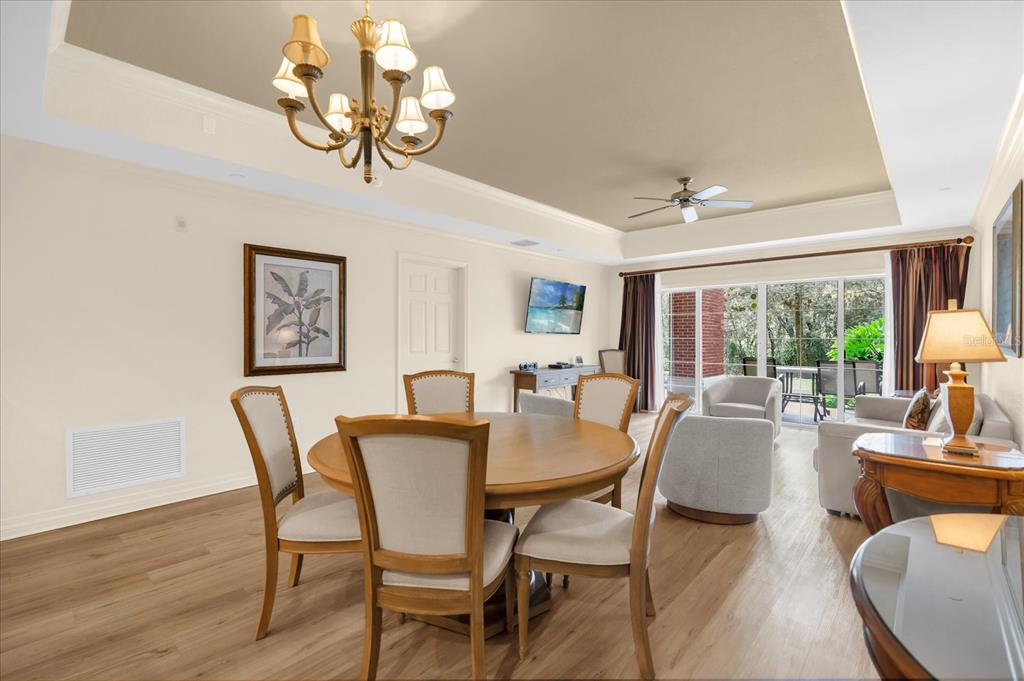 7662 Whisper Way, Unit 103 Reunion, FL 34747 - Photo 7 of 39 a view of a dining room with furniture window and outside view