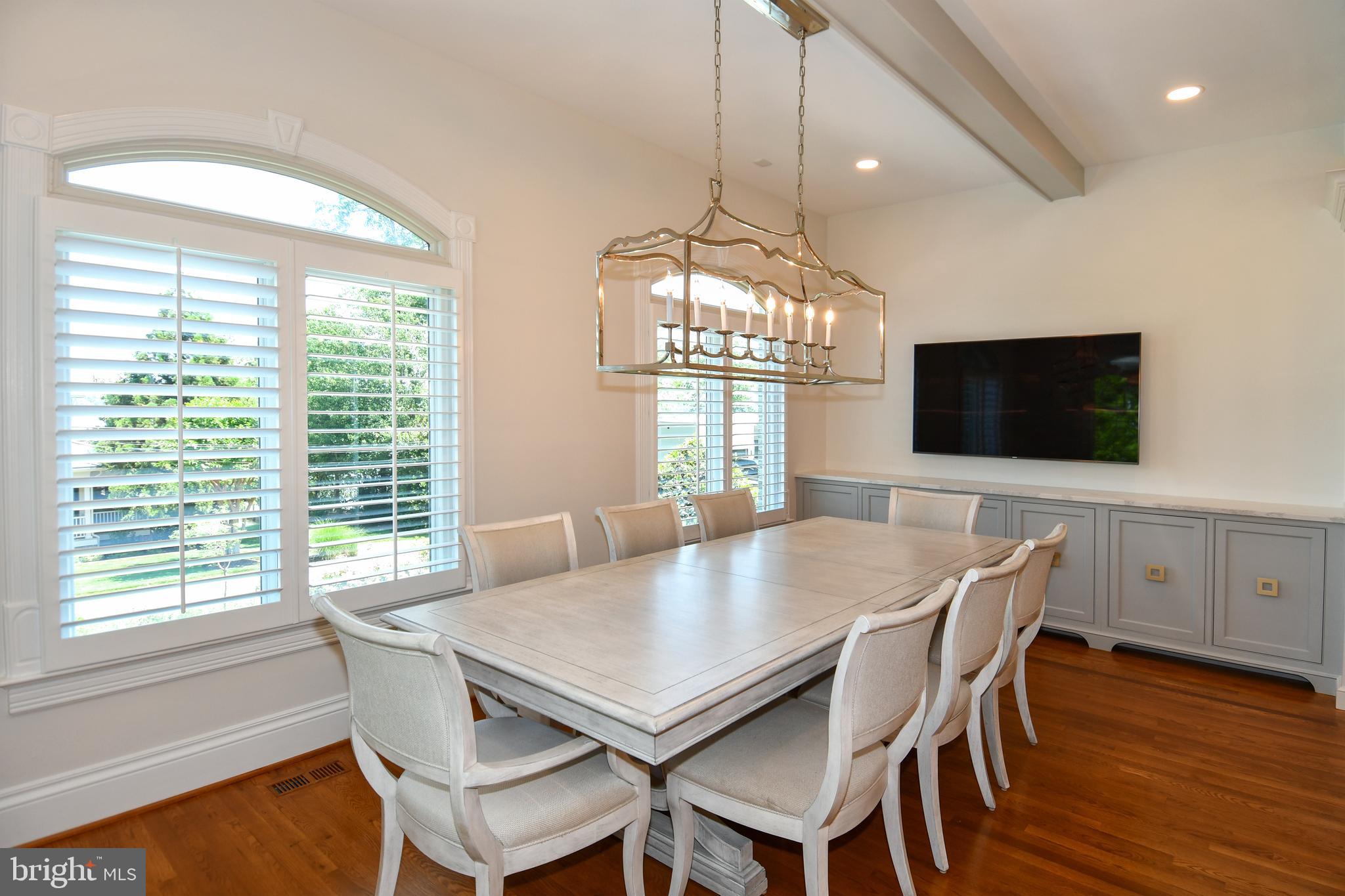 7808 Southdown Road Alexandria, VA 22308 - Photo 40 of 99 a view of a dining room with furniture window and wooden floor