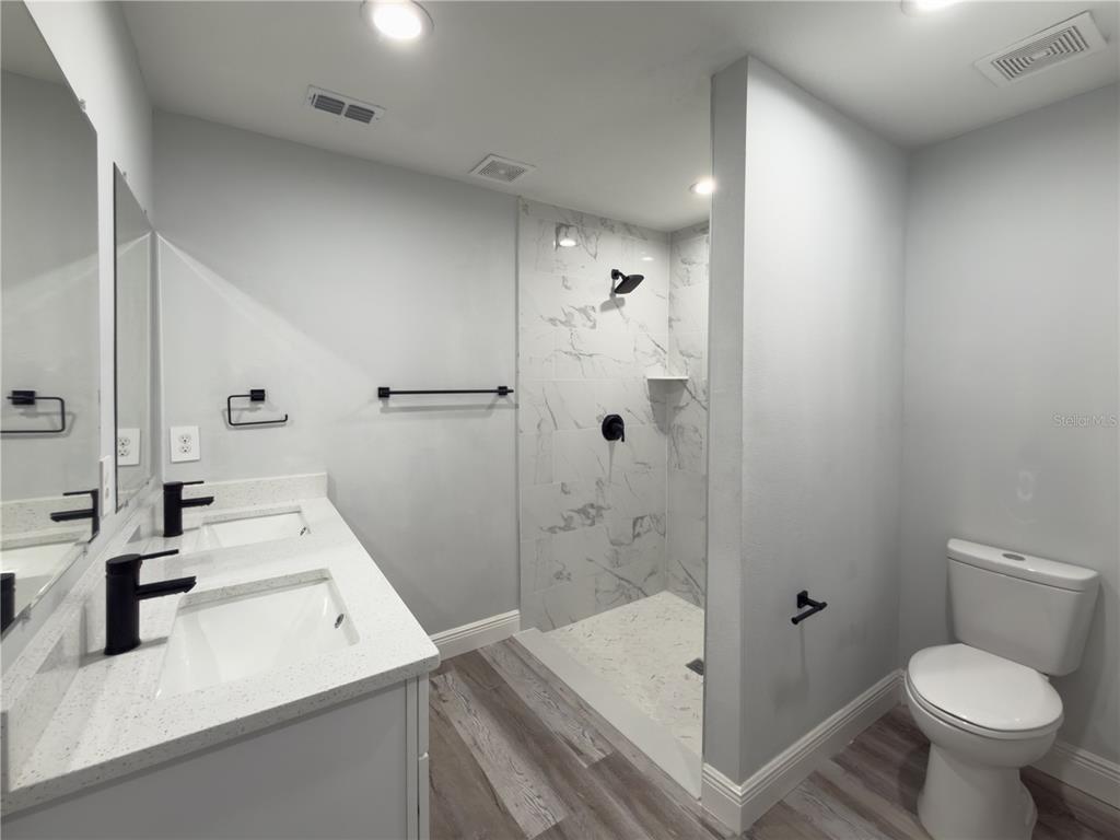4443 Ferrari Drive Sebring, FL 33872 - Photo 6 of 9 a bathroom with a sink toilet and shower