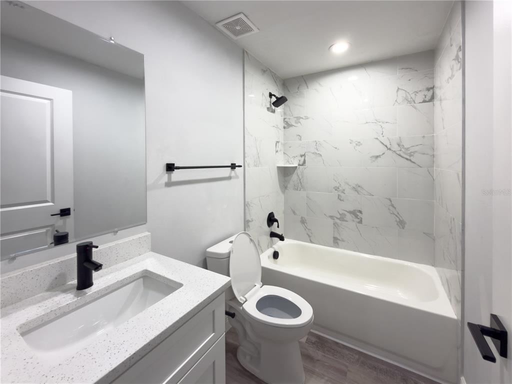4443 Ferrari Drive Sebring, FL 33872 - Photo 8 of 9 a bathroom with a sink a tub and a shower