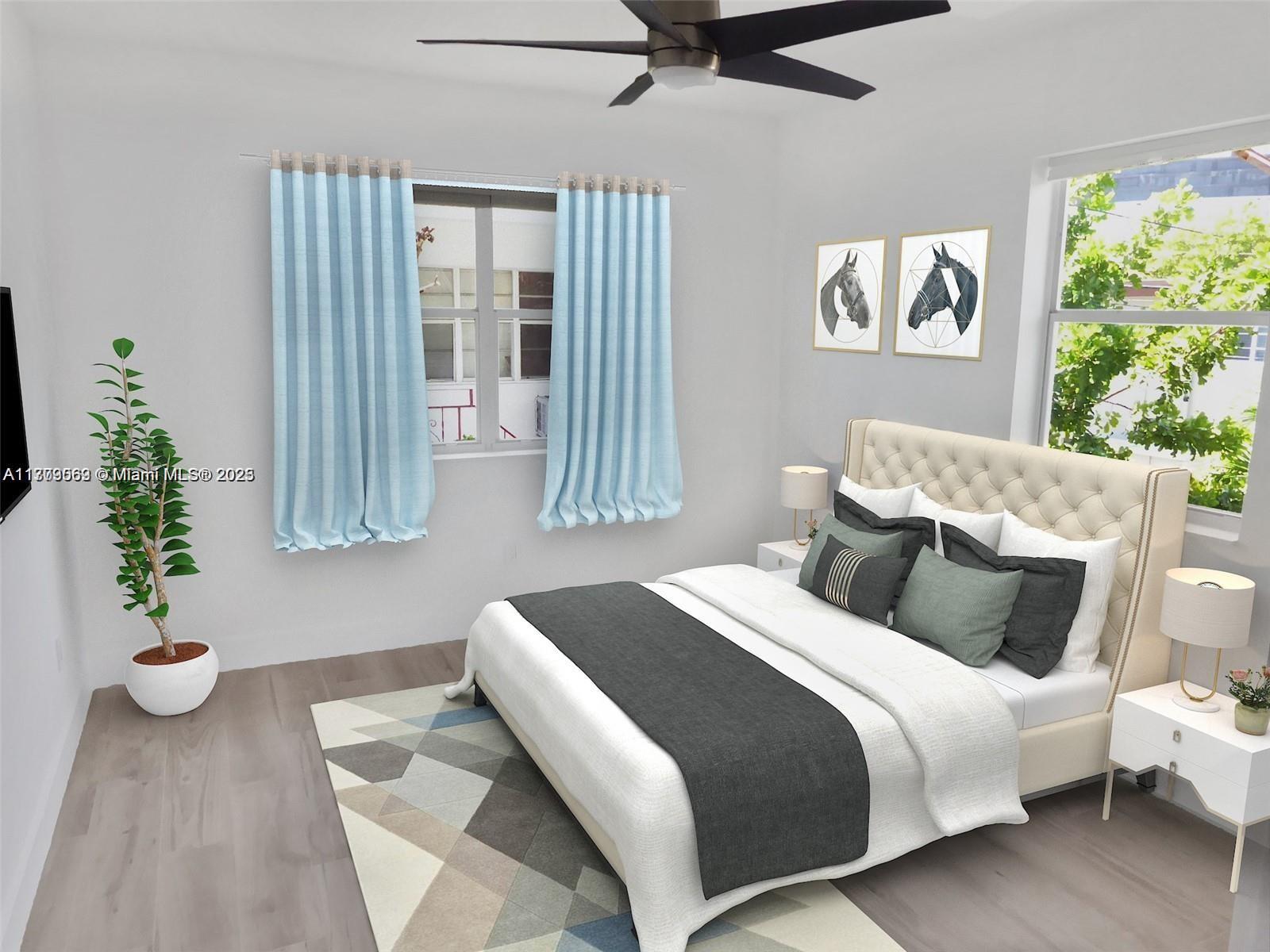 1000 7th Street Miami Beach, FL 33139 - Photo 11 of 41 a bedroom with bed and a potted plant
