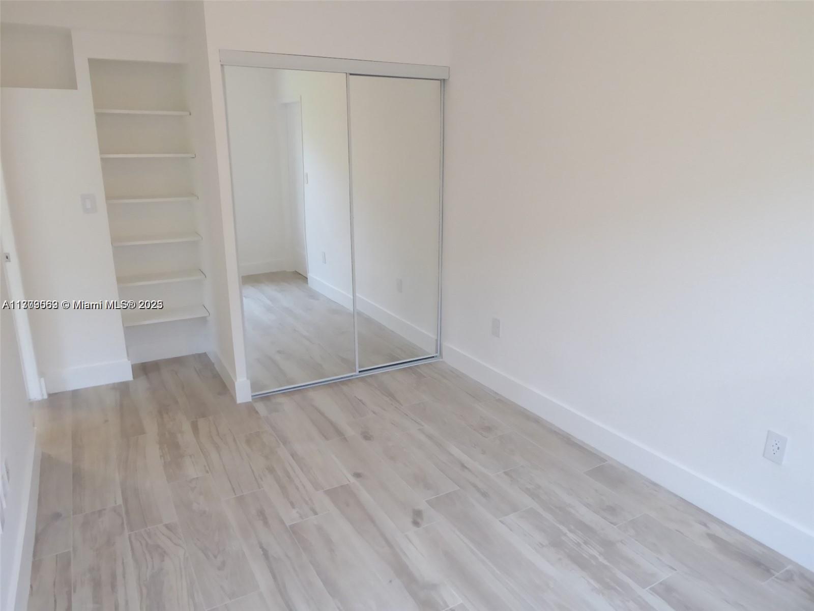 1000 7th Street Miami Beach, FL 33139 - Photo 19 of 41 a view of empty room with wooden floor