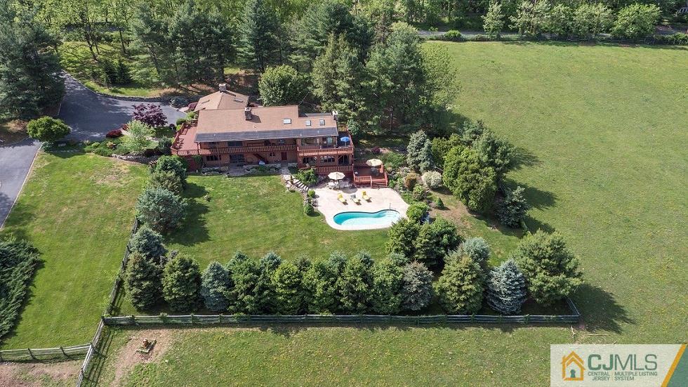 68 Harbourton Woodsville Road Pennington, NJ 08534 - Photo 1 of 25 swimming pool view with a garden space