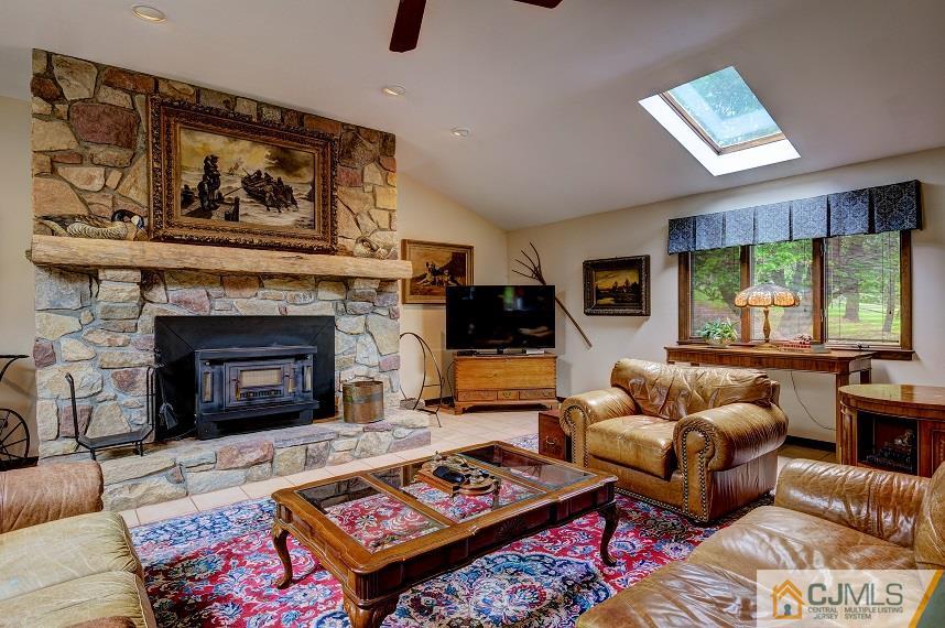 68 Harbourton Woodsville Road Pennington, NJ 08534 - Photo 12 of 25 a living room with furniture and a fireplace