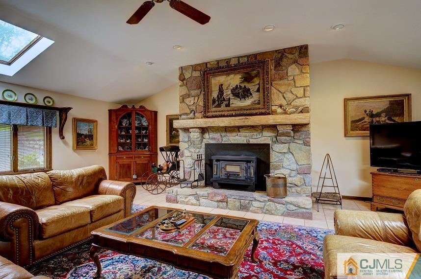 68 Harbourton Woodsville Road Pennington, NJ 08534 - Photo 13 of 25 a living room with furniture and a fireplace