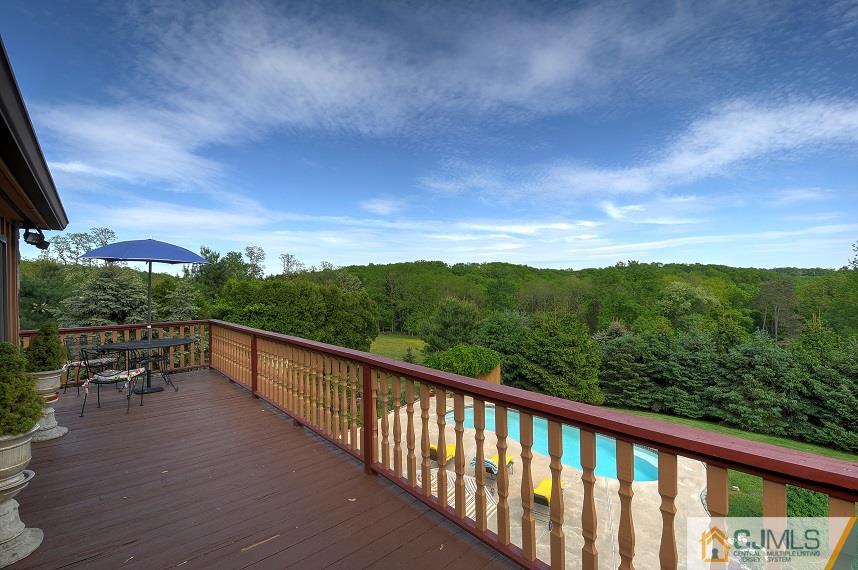 68 Harbourton Woodsville Road Pennington, NJ 08534 - Photo 20 of 25 a view of a city from a balcony with outdoor seating