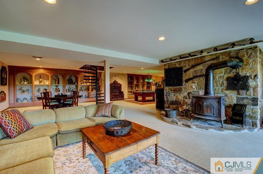 68 Harbourton Woodsville Road Pennington, NJ 08534 - Photo 23 of 25 a living room with furniture a rug and a fireplace