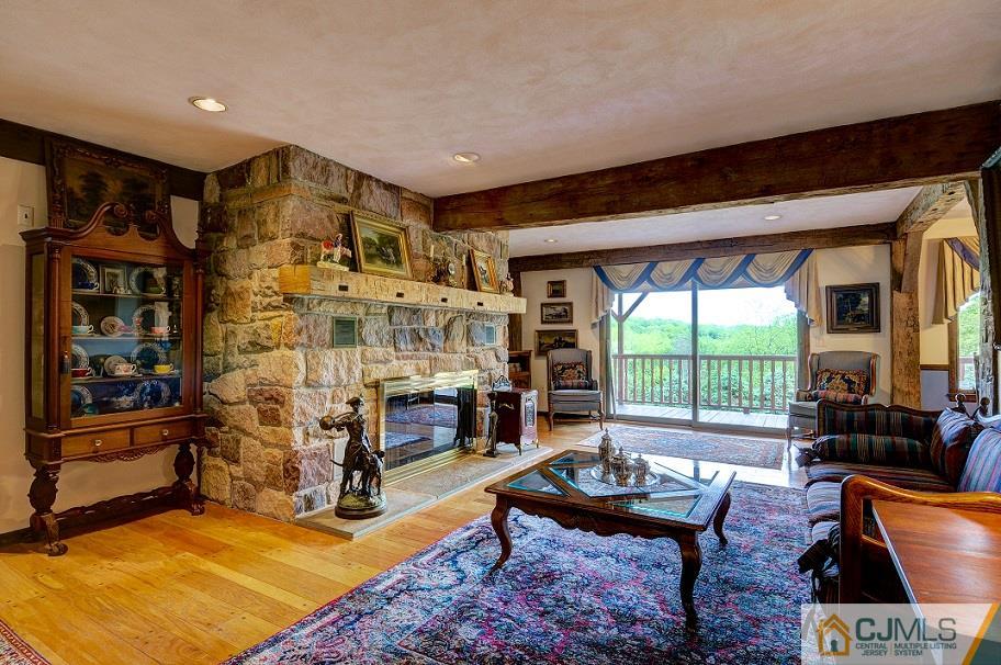 68 Harbourton Woodsville Road Pennington, NJ 08534 - Photo 8 of 25 a living room with fireplace furniture and a large window