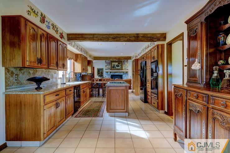 68 Harbourton Woodsville Road Pennington, NJ 08534 - Photo 10 of 25 a kitchen with stainless steel appliances granite countertop a refrigerator and a sink