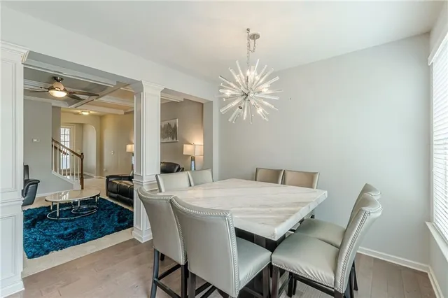 a large bedroom with a bed and furniture