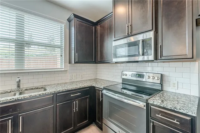 a view of a kitchen area and dining room