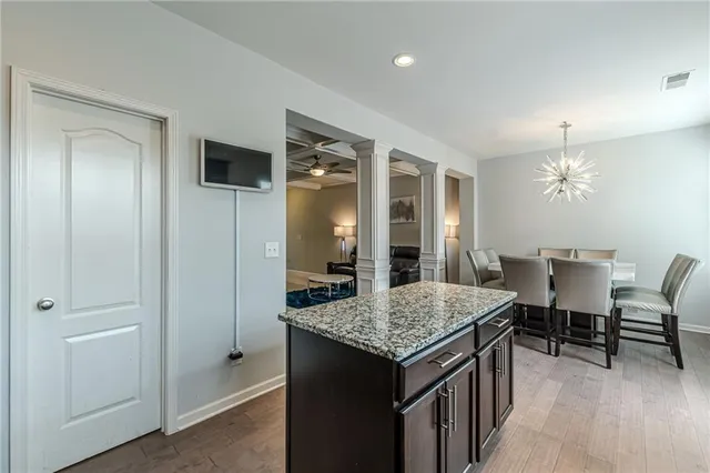 a kitchen with granite countertop a sink and a window
