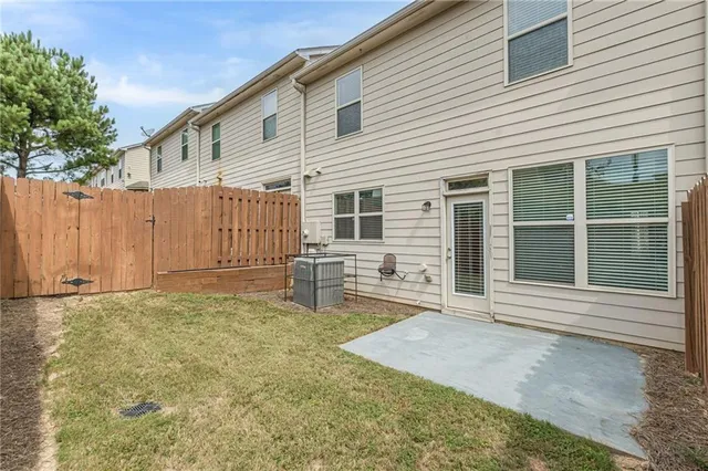 a hallway with a furniture and a mirror