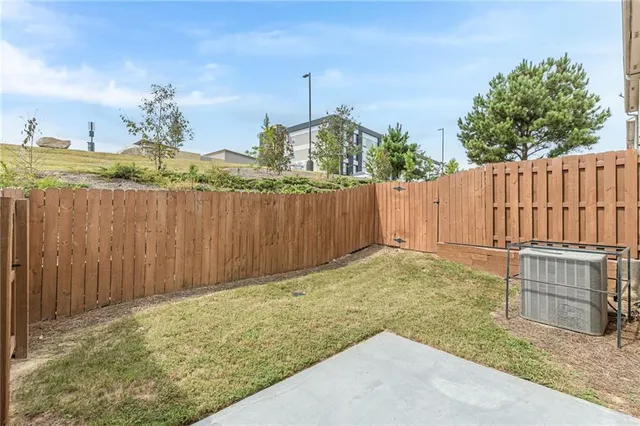 a view of a house with wooden fence