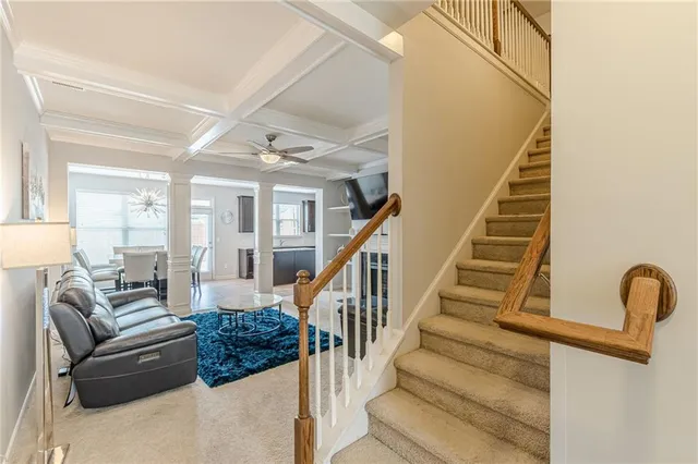 a view of entryway with wooden floor and stairs