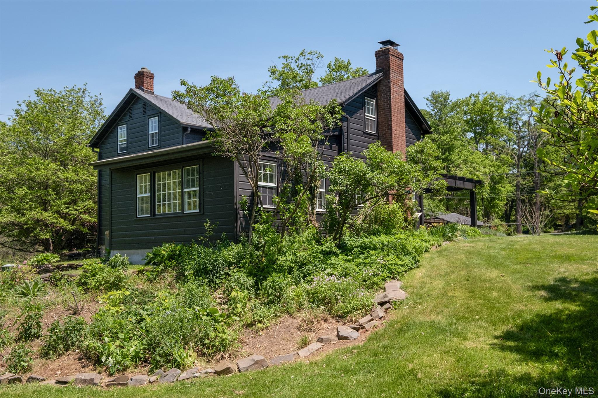 77 Upper Hook Road Rhinebeck, NY 12572 - Photo 3 of 48 a front view of a house with a yard