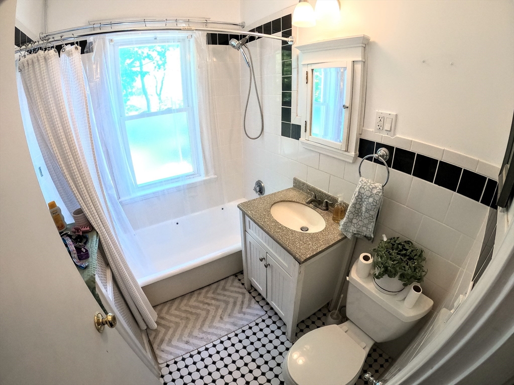 12 Searle Road, Unit 12 Boston, MA 02132 - Photo 17 of 35 a bathroom with a sink toilet and shower