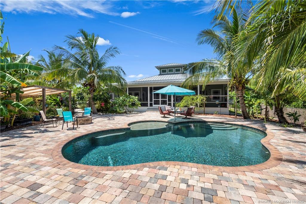 5484 Southeast Horseshoe Point Road Stuart, FL 34997 - Photo 45 of 87 a view of a swimming pool with a patio