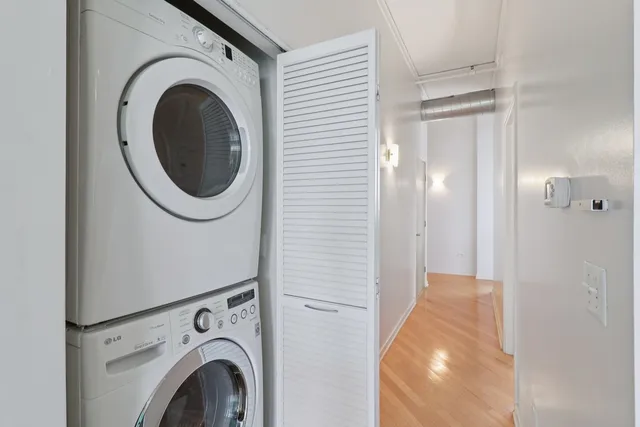 a view of a hallway with washer and dryer