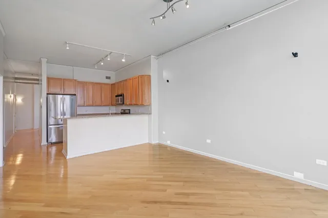 a view of kitchen with wooden floor