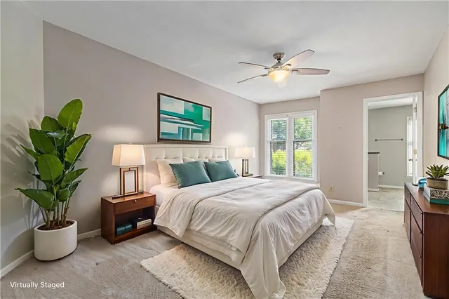 a bedroom with a balcony a bed and a chandelier