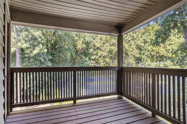 a view of a two chairs in the balcony