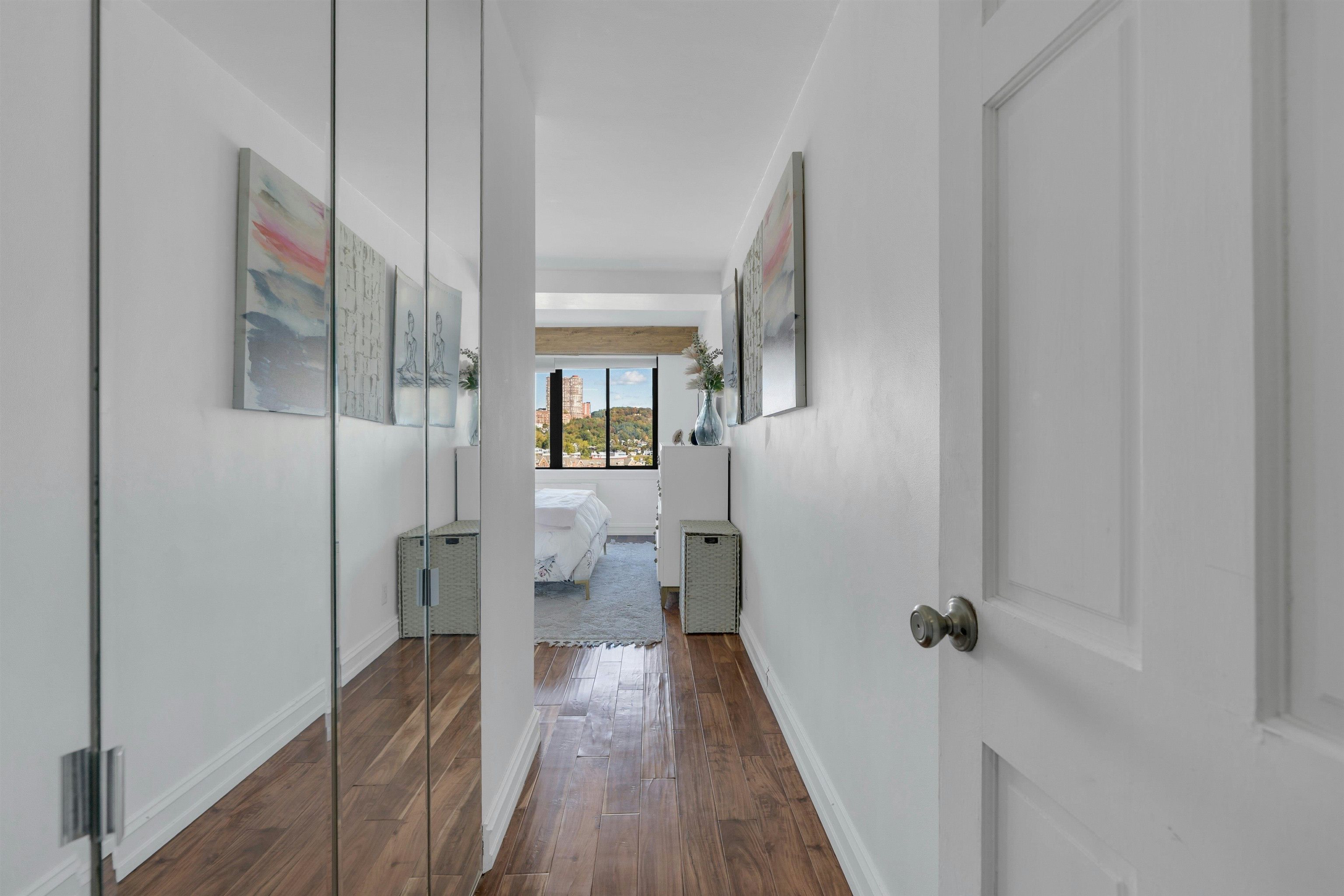 1203 River Road, Unit 9D Edgewater, NJ 07020 - Photo 14 of 28 a view of a bathroom from a hallway