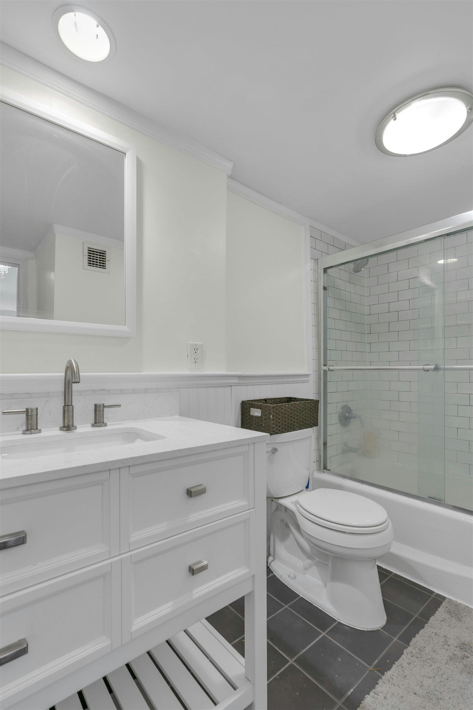 1203 River Road, Unit 9D Edgewater, NJ 07020 - Photo 18 of 28 a bathroom with a sink a toilet and a mirror