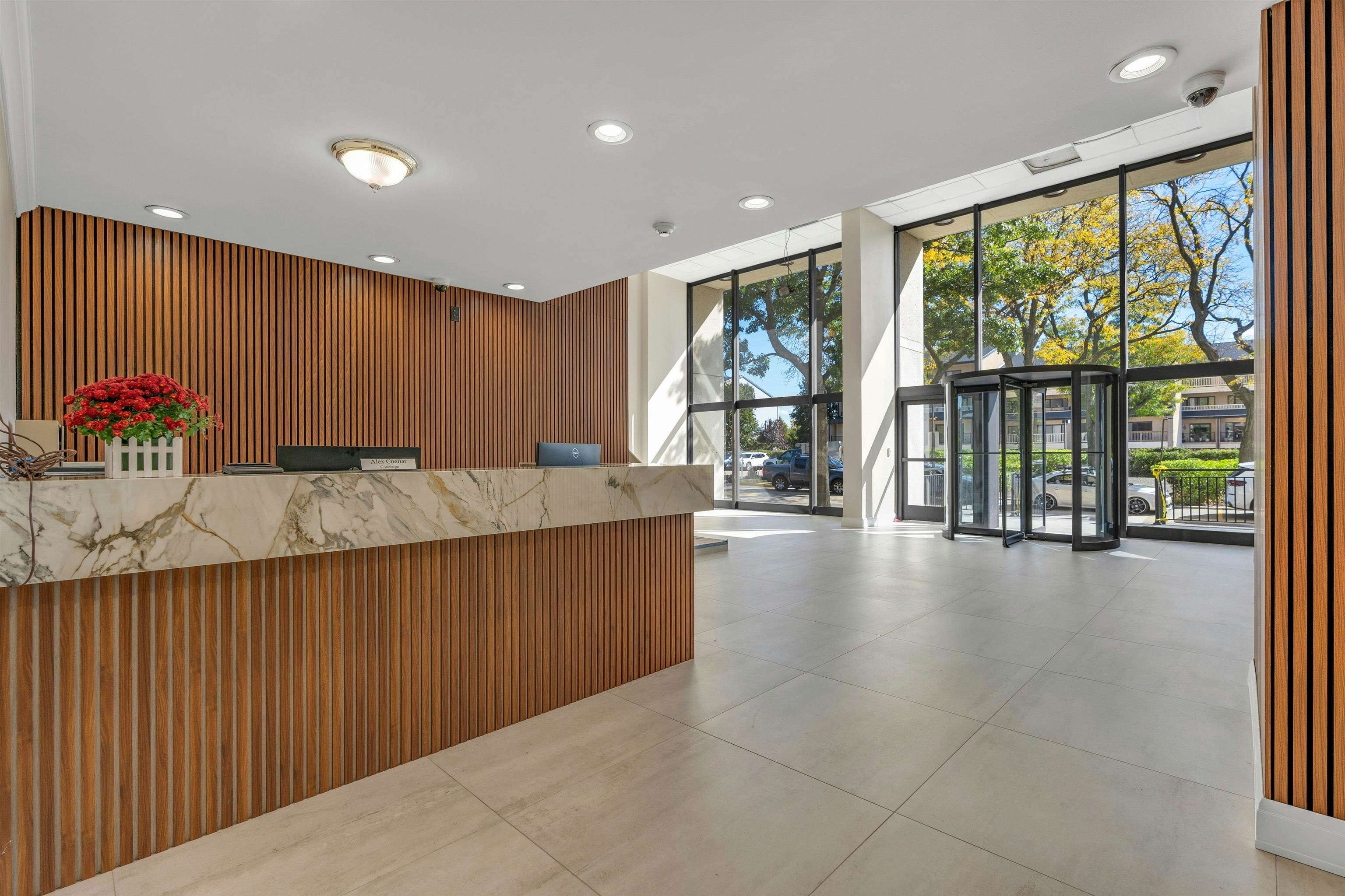 1203 River Road, Unit 9D Edgewater, NJ 07020 - Photo 2 of 28 a lobby with a couch and wooden floor