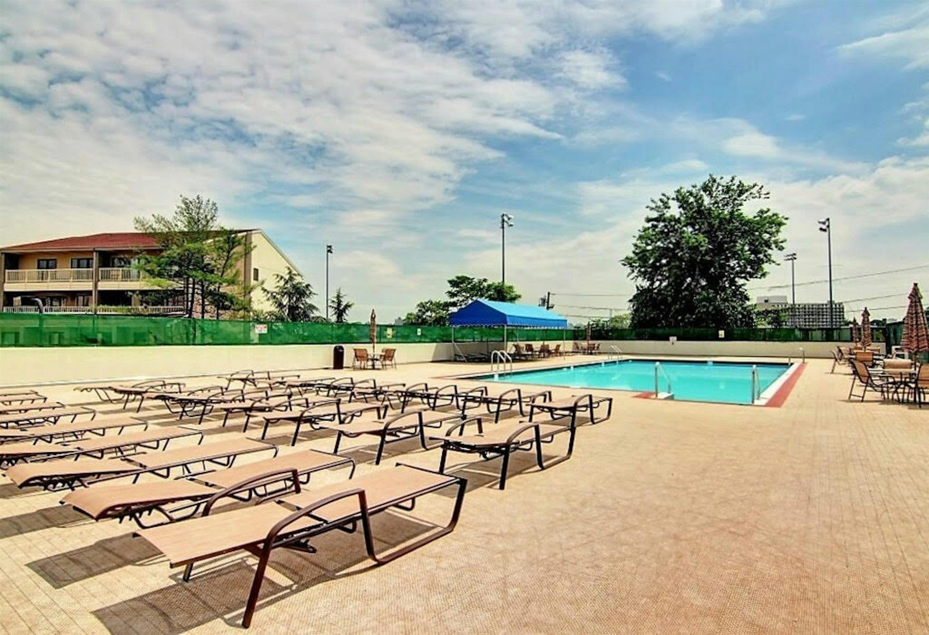 1203 River Road, Unit 9D Edgewater, NJ 07020 - Photo 27 of 28 a view of swimming pool with outdoor seating and yard in back