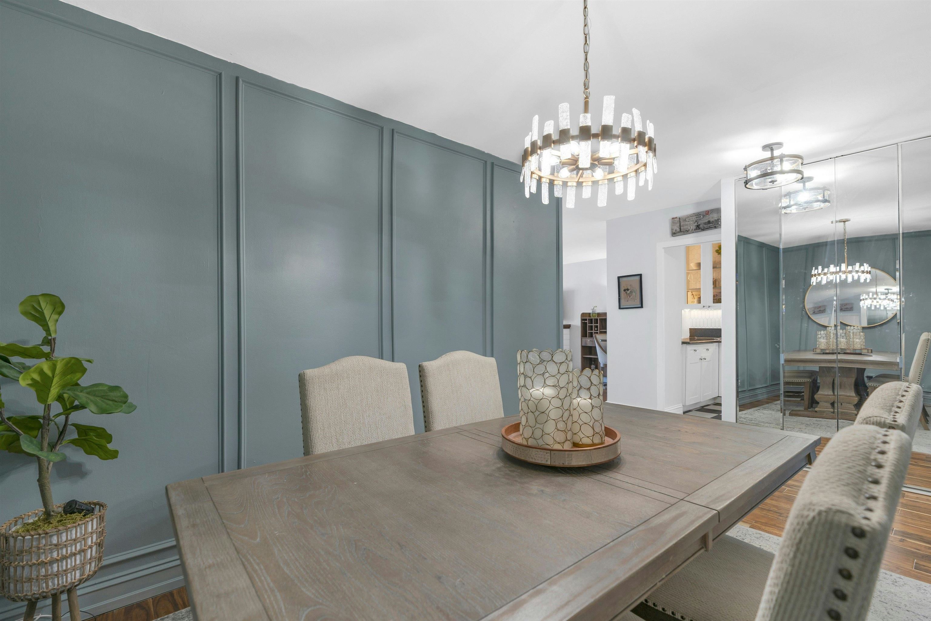 1203 River Road, Unit 9D Edgewater, NJ 07020 - Photo 5 of 28 a view of a dining room with furniture and chandelier