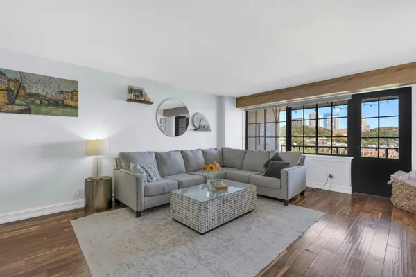 a living room with furniture and a large window