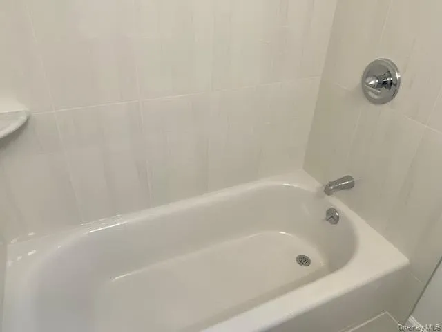 a close up of a bathtub in a bathroom