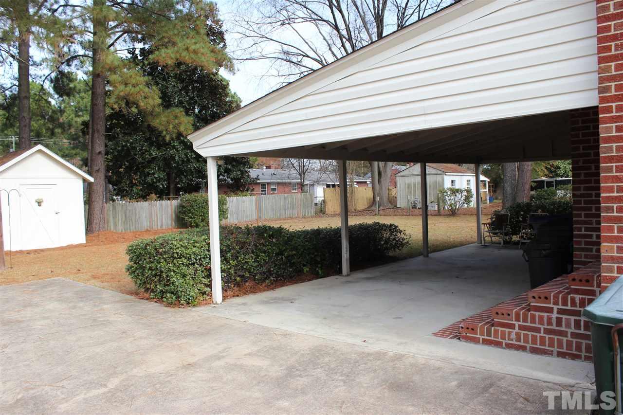 3120 Amherst Road Rocky Mount, NC 27804 - Photo 25 of 25 Ideal attached carport has door to the kitchen for easy deliveries! Sizable backyard for whatever your hobby!