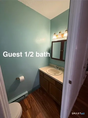 a bathroom with a toilet and a sink