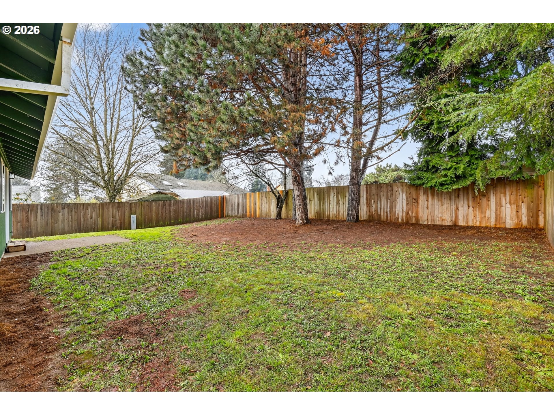 18830 Southwest Butternut Street Beaverton, OR 97078 - Photo 28 of 33 a view of a backyard with large trees