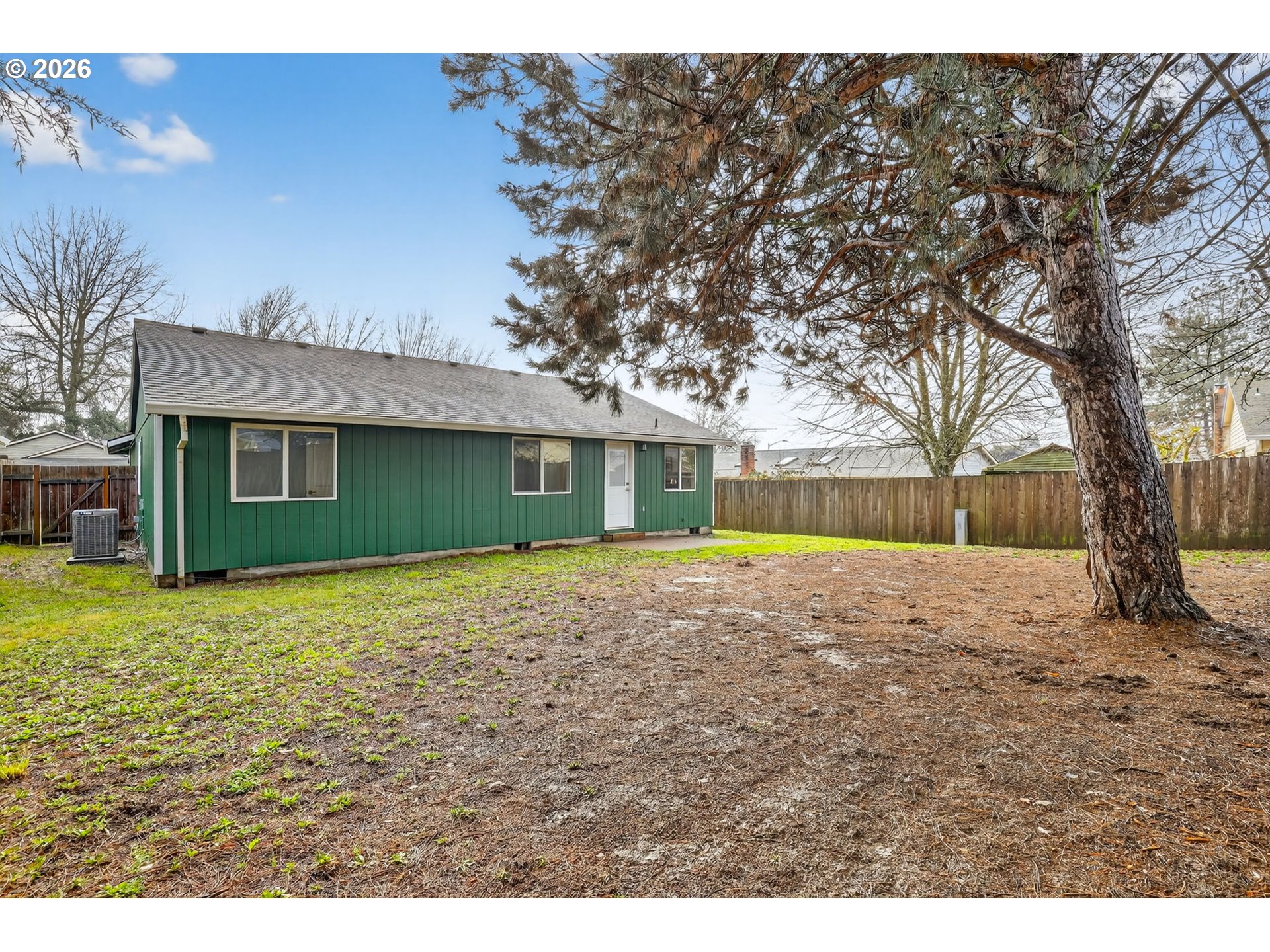18830 Southwest Butternut Street Beaverton, OR 97078 - Photo 29 of 33 a view of a house with a yard and large tree