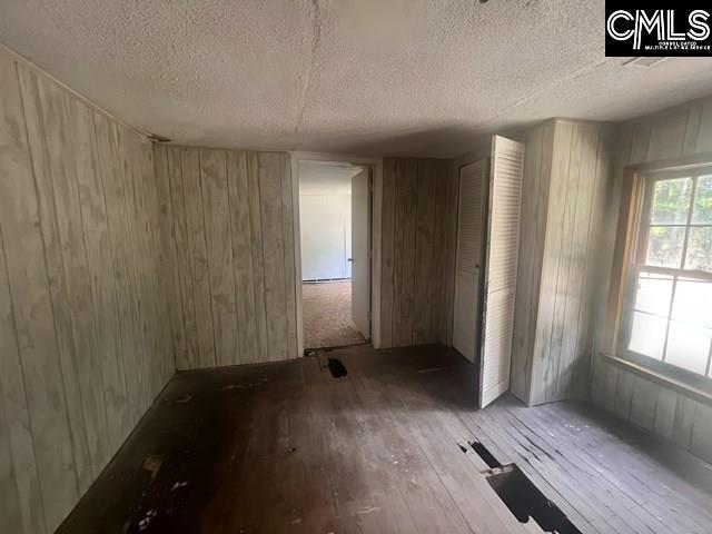 5545 Pisgah Road Rembert, SC 29128 - Photo 23 of 26 an empty room with wooden floor and windows