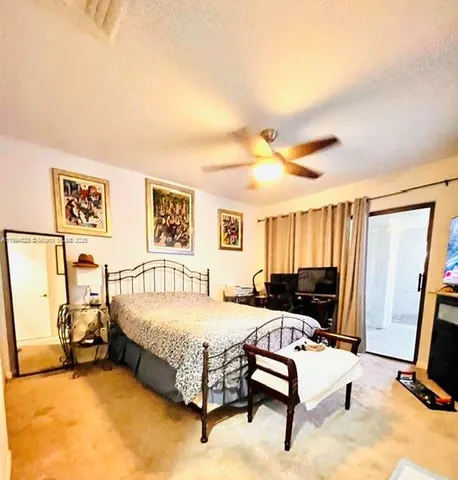 a bedroom with a bed and a furniture