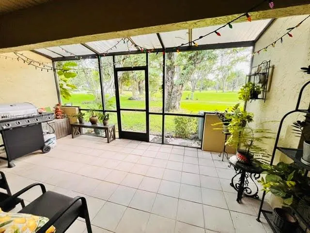 a view of a chairs and table in the patio