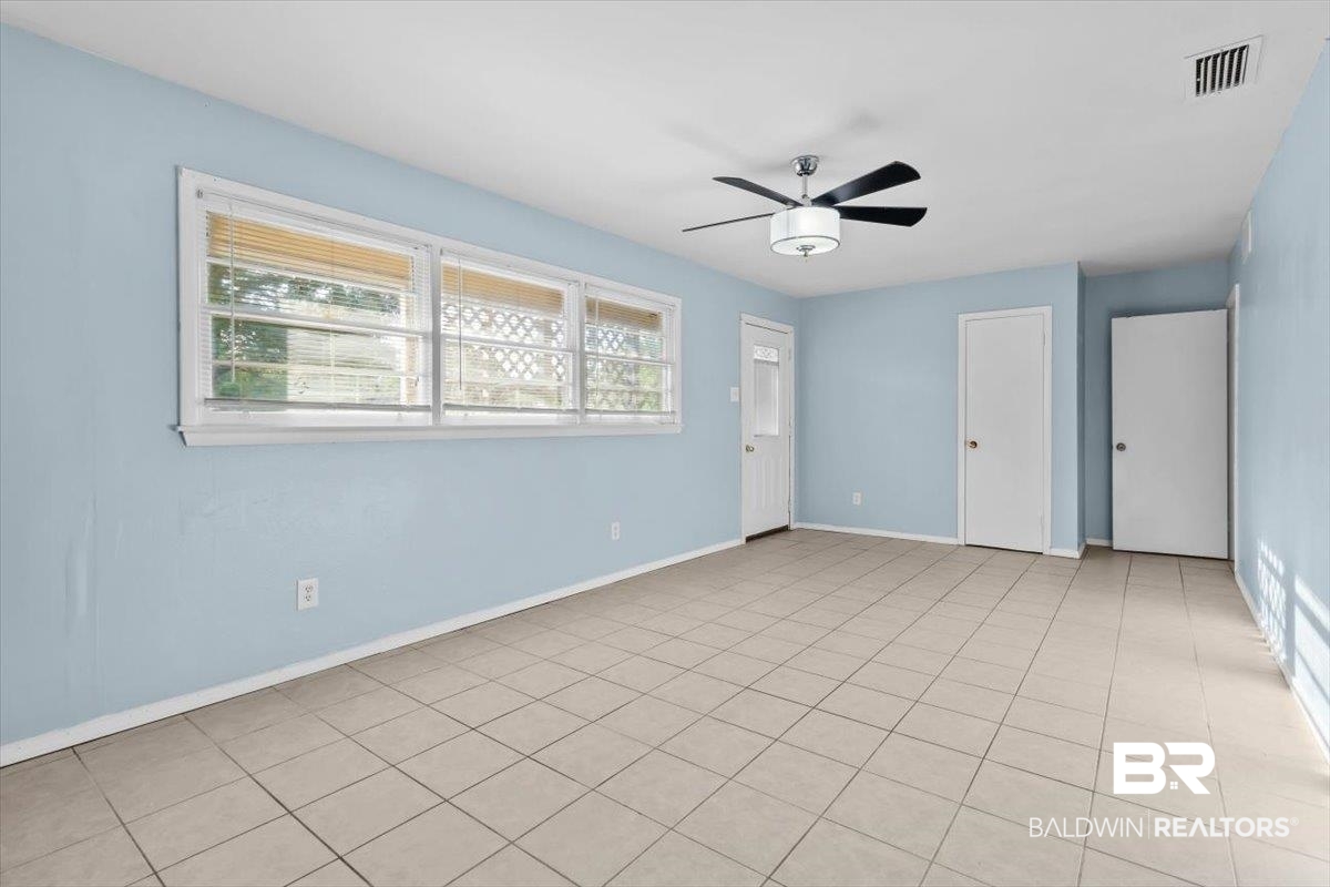 4918 Quimby Drive Mobile, AL 36619 - Photo 12 of 38 Unfurnished bedroom with baseboards and ceiling fan