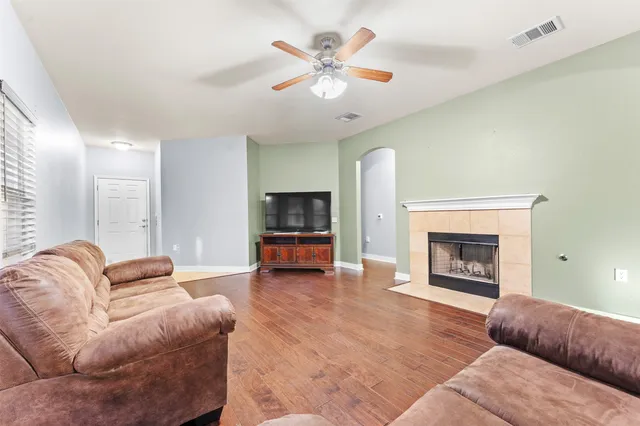 a living room with furniture and a fireplace