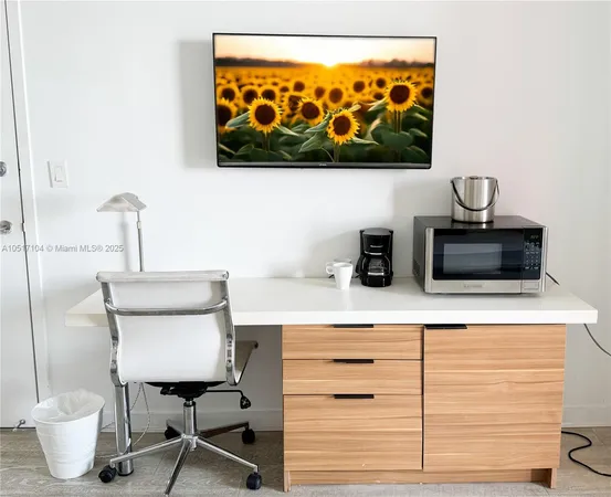 a bedroom with two beds and a painting on the wall