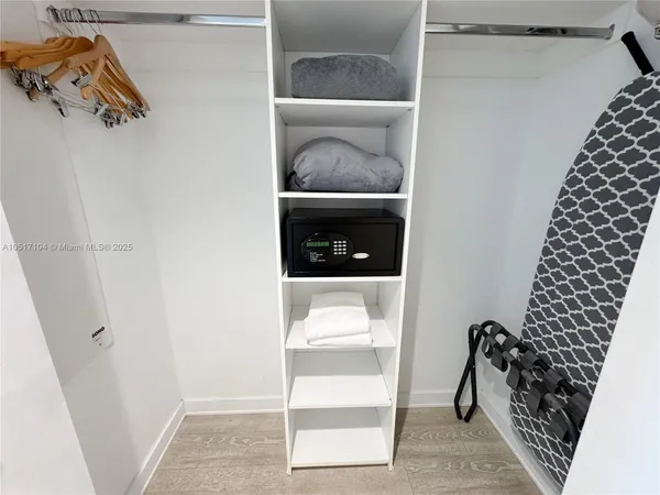 a bedroom with two beds and a window