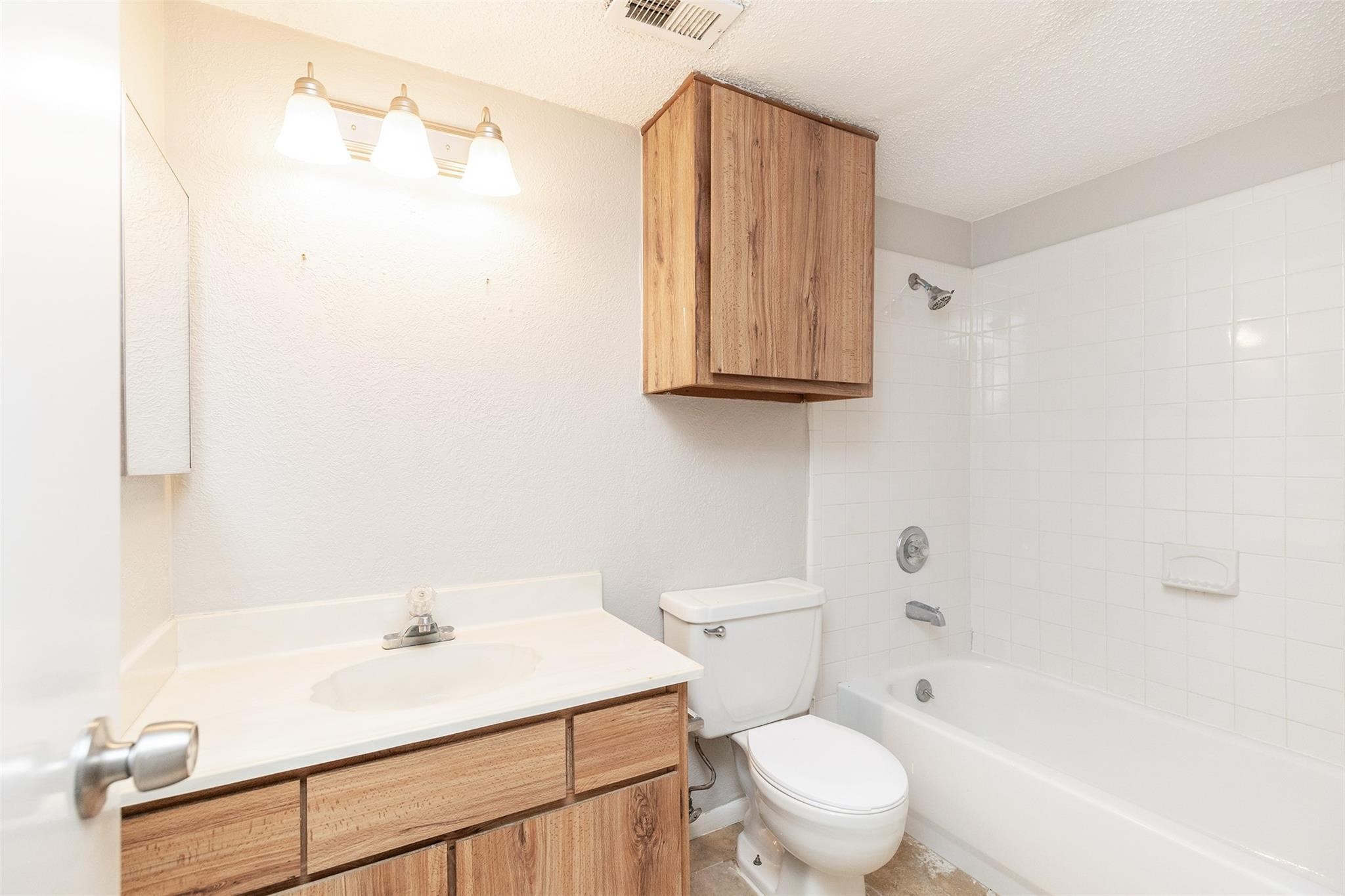 2800 Jeanetta Street, Unit 2805 Houston, TX 77063 - Photo 13 of 19 a bathroom with a sink a toilet and shower